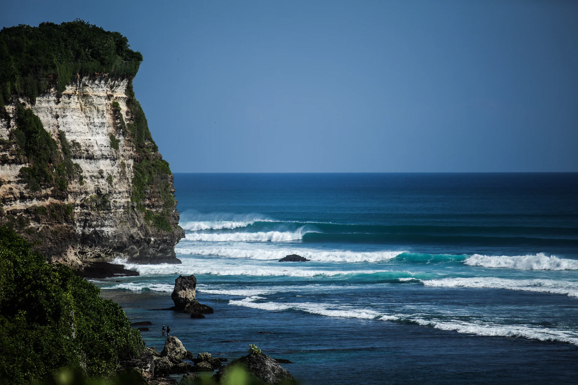 Waves breaking off the cliffs at Uluwatu surf break